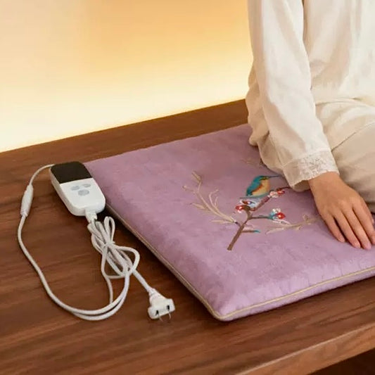 Coussin d'assise chauffant à la moxa