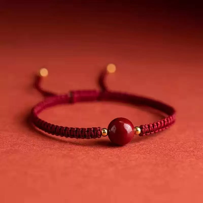 Bracelet cordon rouge avec perle de cinabre