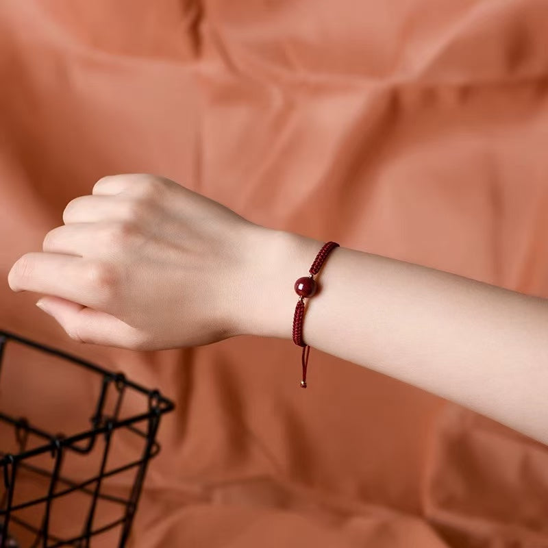 Bracelet cordon rouge avec perle de cinabre